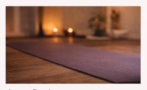 A purple yoga mat in the studio