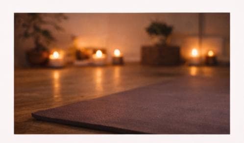 A yoga mat in a softly lit studio