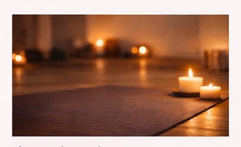 A candlelit yoga mat prepared for vinyasa