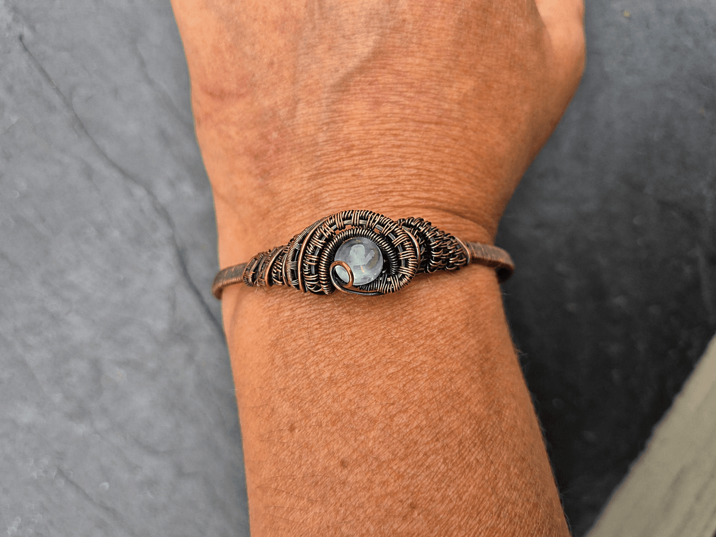 Handmade blue chalcedony cuff being worn
